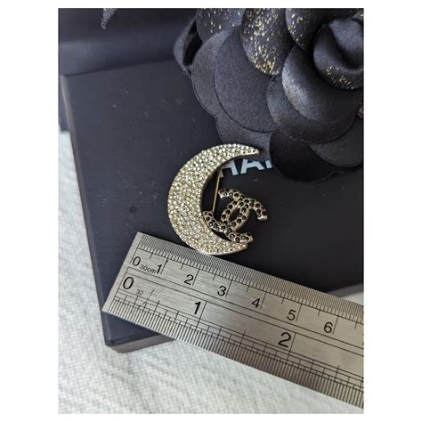 chanel crescent moon brooch